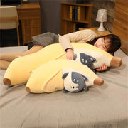young woman cuddling cute kawaii chonky banana husky dog plushies